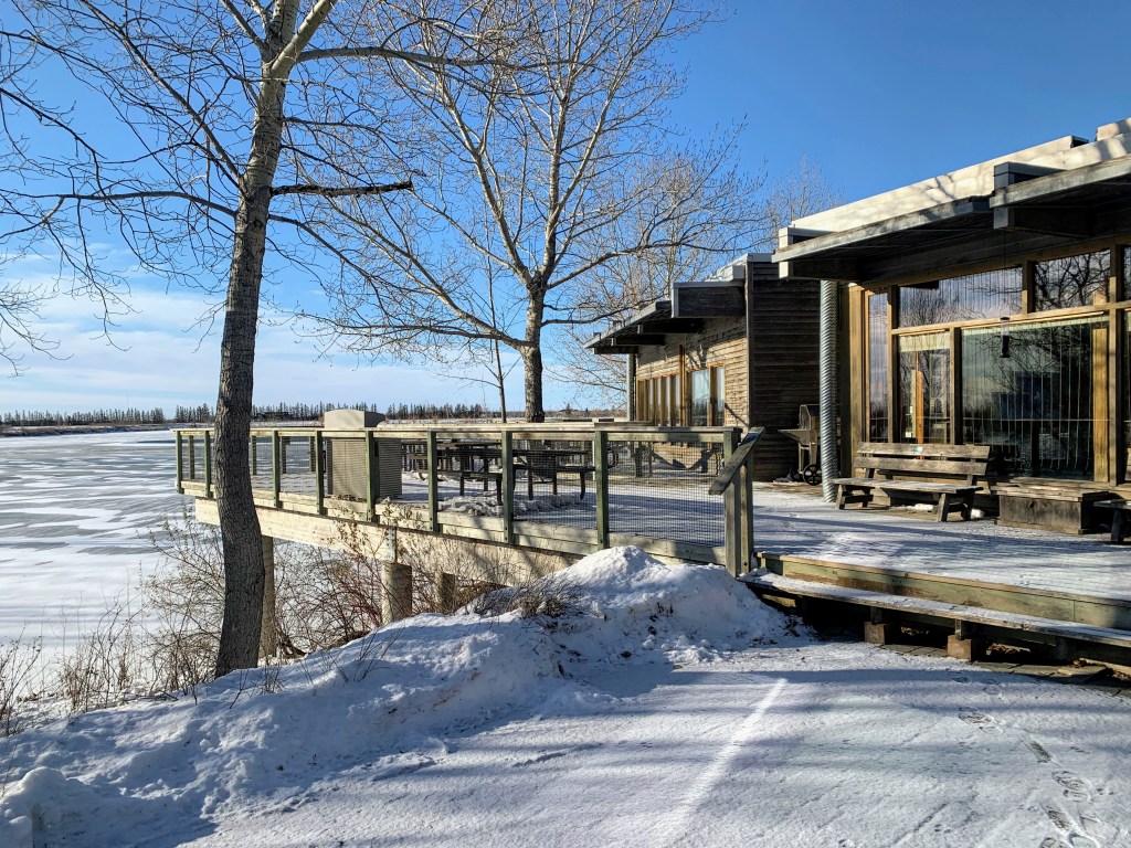 The entrance to and patio of a building in winter